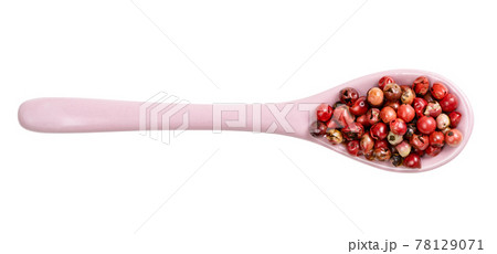 top view of ceramic spoon with pink peppercorns top view of ceramic spoon with pink peppercorns 78129071