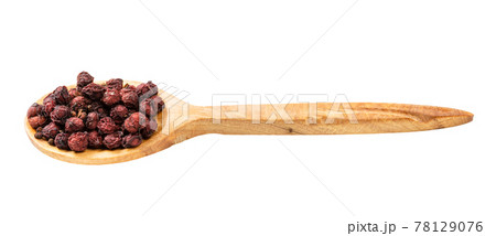 wooden spoon with dried schisandra fruits isolated 78129076