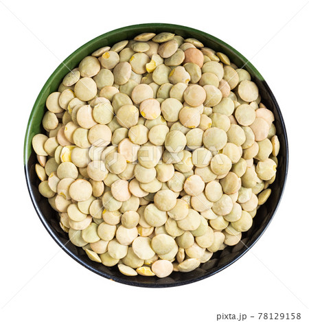 whole light green lentils in round bowl isolated 78129158