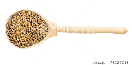 top view of spoon with whole milk thistle seeds 78129213
