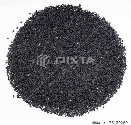 Nigella sativa seeds (black caraway) on gray plate 78129269