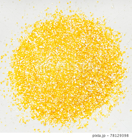 pile of coarse cornmeal close up on gray pile of coarse cornmeal close up on gray 78129398