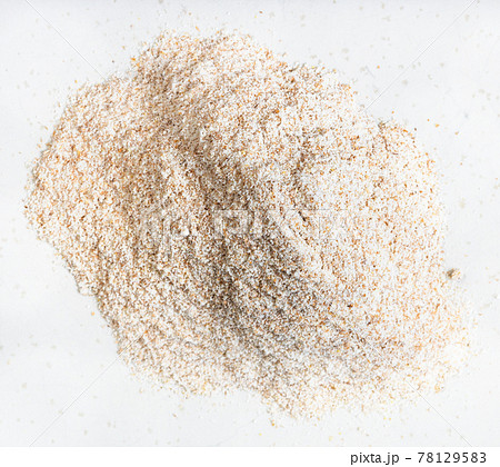 pile of whole-grain wheat flour close up on gray 78129583