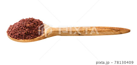 wooden spoon with ground sumac isolated wooden spoon with ground sumac isolated 78130409