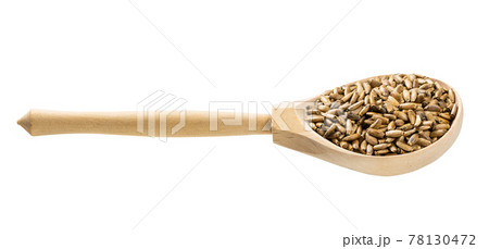 wood spoon with whole milk thistle seeds isolated 78130472
