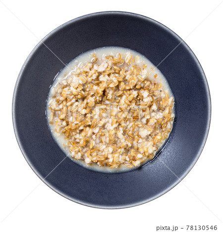 cooked porridge from wholegrain oat in gray bowl cooked porridge from wholegrain oat in gray bowl 78130546
