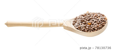 wooden spoon with unhulled red lentils isolated 78130736