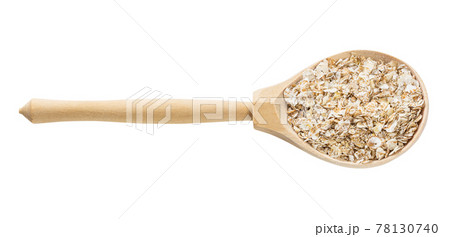 wooden spoon with raw four cereal flakes isolated wooden spoon with raw four cereal flakes isolated 78130740