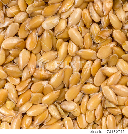 golden flax seeds close up 78130745