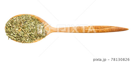 top view of spoon with ground parsley isolated 78130826
