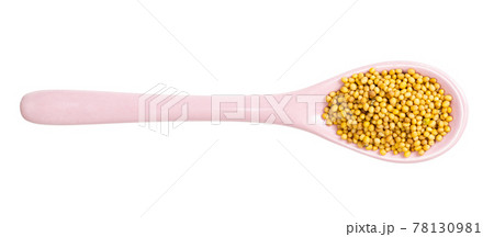 ceramic spoon with yellow mustard seeds 78130981
