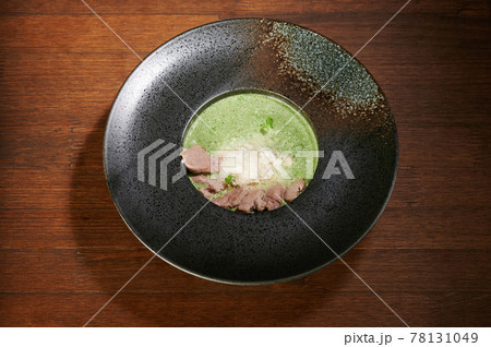Healthy soup in grungy black plate Healthy soup in grungy black plate 78131049