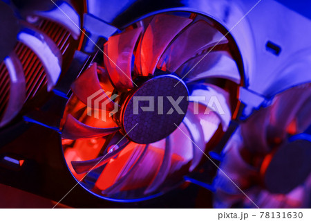Gaming graphics card with neon magenta-cyan illumination and high-speed fans. 78131630