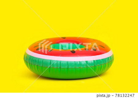 Inflatable of watermelon on yellow background. 78132247