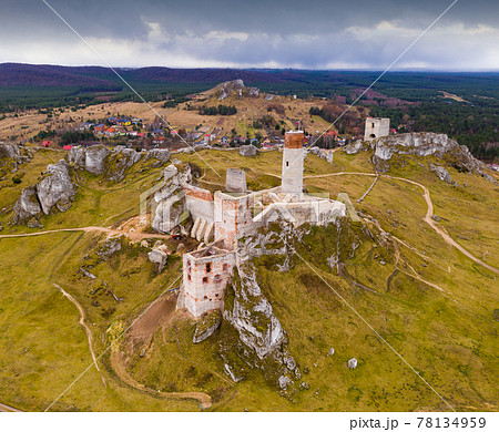 View from drone of remains of ancient destroyed Castle in Polish village of Olsztyn in Czestochowa County in springtime View from drone of remains of ancient destroyed Castle in Polish village of Olsztyn in Czestochowa County in springtime 78134959