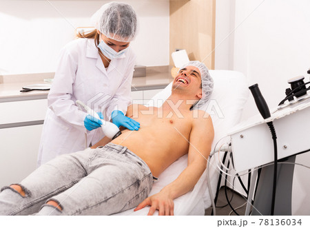 Laughing man during hardware body procedure Laughing man during hardware body procedure 78136034