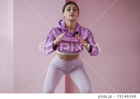 Beautiful girl wearing fashion sportswear doing exercise at gym. 78146366