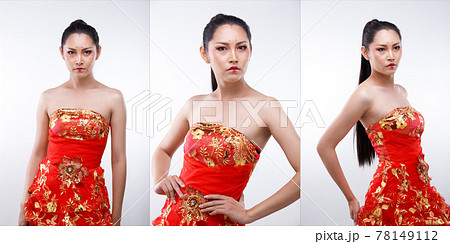 ..Half Body Portrait of 20s Asian Woman long straight black hair wear Red Gold Traditional Chinese Costume cosplay. Girl poses over white Background isolated ..Half Body Portrait of 20s Asian Woman long straight black hair wear Red Gold Traditional Chinese Costume cosplay. Girl poses over white Background isolated 78149112