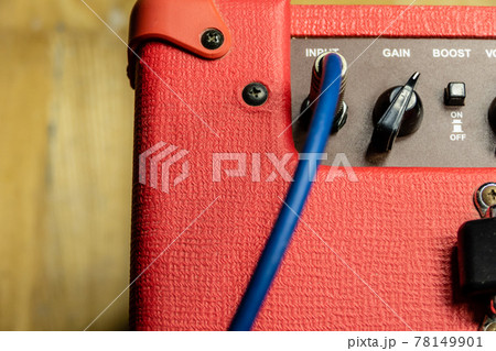 Control panel of red electric guitar amplifier Control panel of red electric guitar amplifier 78149901