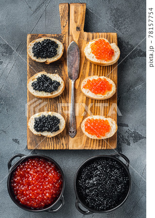 Sandwiches with red and black caviar , on gray background, top view flat lay 78157754