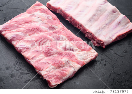 Raw Pork ribs, on black stone background, with copy space for text Raw Pork ribs, on black stone background, with copy space for text 78157975