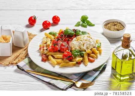 Pasta of penne, bacon, tomatoes, and mozzarella 78158523