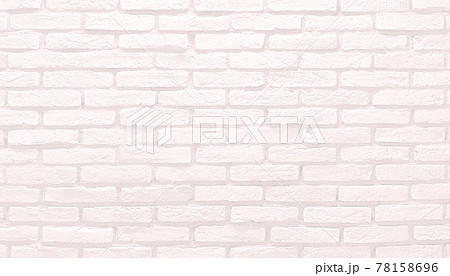 淡いピンク色のレンガの壁の背景画像の写真素材