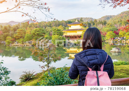 solo woman tourist trveling at Kinkakuji temple or the golden pavilion in Autumn season, Asian traveler visit in Kyoto, Japan. Vacation, destination and travel concept solo woman tourist trveling at Kinkakuji temple or the golden pavilion in Autumn season, Asian traveler visit in Kyoto, Japan. Vacation, destination and travel concept 78159068