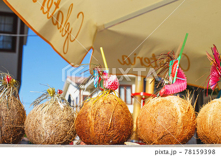 a Tropical coconut cocktails on the coast a Tropical coconut cocktails on the coast 78159398
