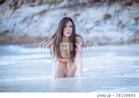 Portrait beautiful young model asian woman wearing swimming suite bikini posing sexy feel happy on the sea ocean beach for leisure travel vacation on summer season Portrait beautiful young model asian woman wearing swimming suite bikini posing sexy feel happy on the sea ocean beach for leisure travel vacation on summer season 78159693