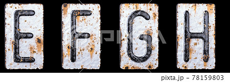 3D render set of capital letters E, F, G, H made of forged metal on the background fragment of a metal surface with cracked rust. 78159803