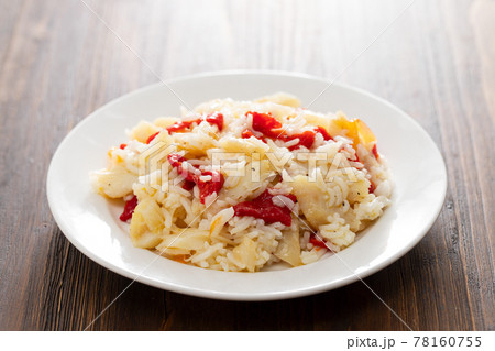 rice with cod fish and red pepper on white plate 78160755