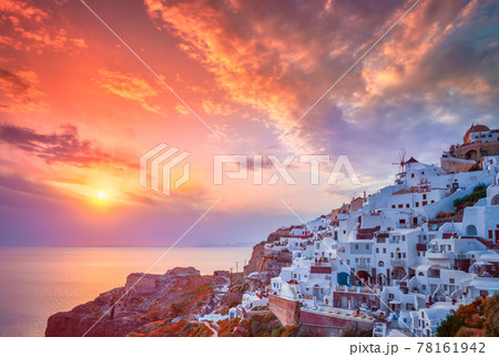 Sunset over Oia town on Santorini island in summer. Santorini, Greece 78161942
