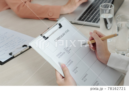 Applicant writing down her personal information Applicant writing down her personal information 78162721