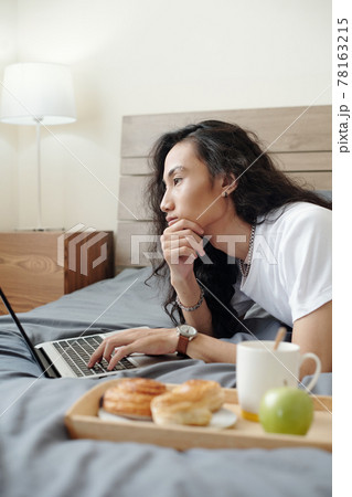 Pensive online manager thinking of project 78163215