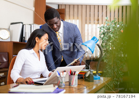 Two business colleagues working in modern office Two business colleagues working in modern office 78167194