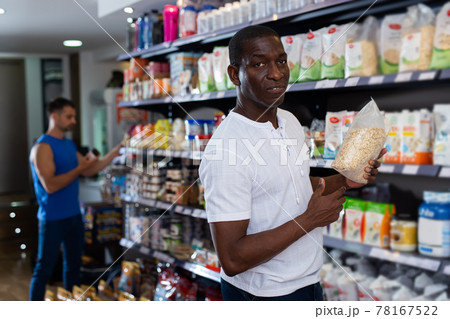 man happy with buying oatmeal 78167522