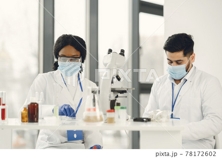 Researchers creating vaccine for covid-19 in a lab 78172602