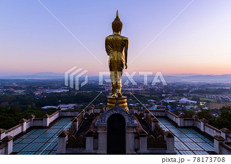 Big golden buddha statue standing in Wat Phra That Kao Noi 78173708