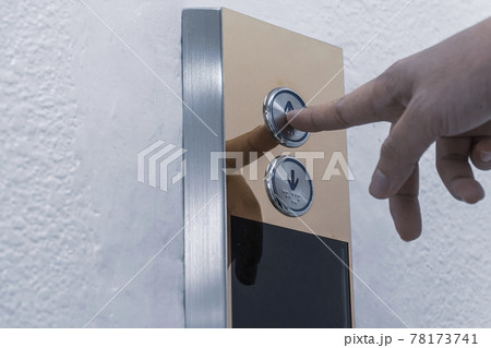 Hand finger push the elevator button up or lift Hand finger push the elevator button up or lift 78173741