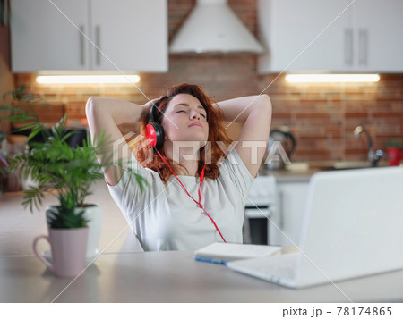 Funky hipster woman listening favorite song or music podcast 78174865