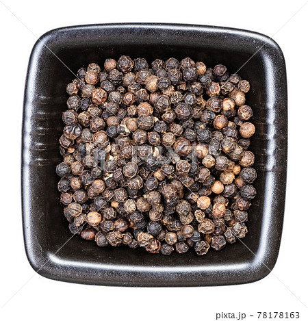 black pepper peppercorns in black bowl isolated black pepper peppercorns in black bowl isolated 78178163