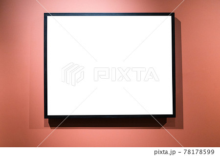 narrow black picture frame on red wall 78178599