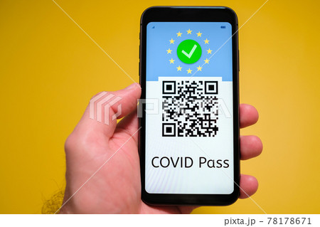 Covid pass with QR code on the screen in smartphone in mans hand on the yellow background, May 2021, San Francisco, USA. Covid pass with QR code on the screen in smartphone in mans hand on the yellow background, May 2021, San Francisco, USA. 78178671