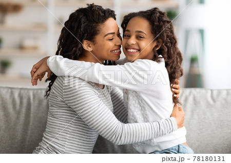 Sweet african american girl spending time with her mother Sweet african american girl spending time with her mother 78180131