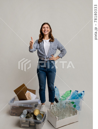 Sustainability Concept. Woman Standing Next To Containers With Different Materials For Recycling 78180333