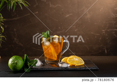 Refreshing iced tea with lemon. Cold lemonade. Lemon, lime and mint. Composition with tea and lemon. Refreshing iced tea with lemon. Cold lemonade. Lemon, lime and mint. Composition with tea and lemon. 78180676