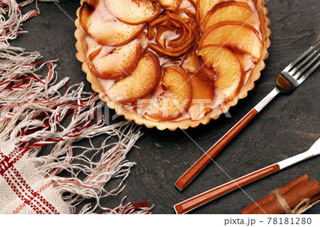 Apple tart pie on black surface close up Apple tart pie on black surface close up 78181280