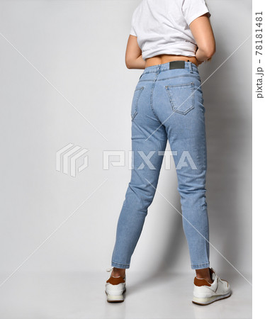 young skinny woman dressed in stylish blue jeans young skinny woman dressed in stylish blue jeans 78181481