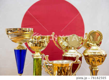 Sports cups on the background of the Japanese flag, wallpaper for sports design. Awards 78182505